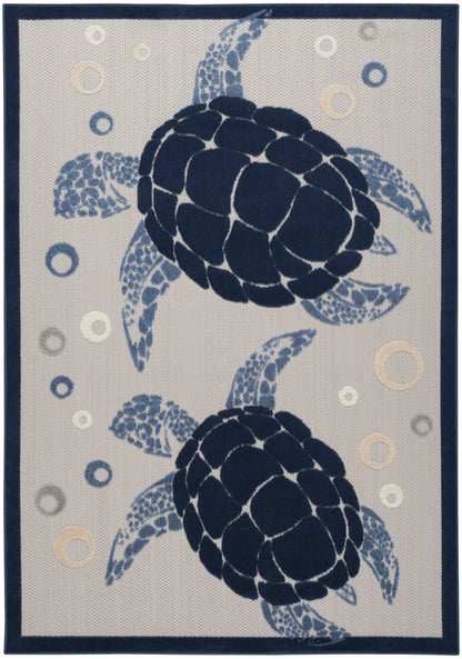 Navy sea turtle rug: two segmented-shell turtles on beige background with pale circle bubbles, dark blue border.