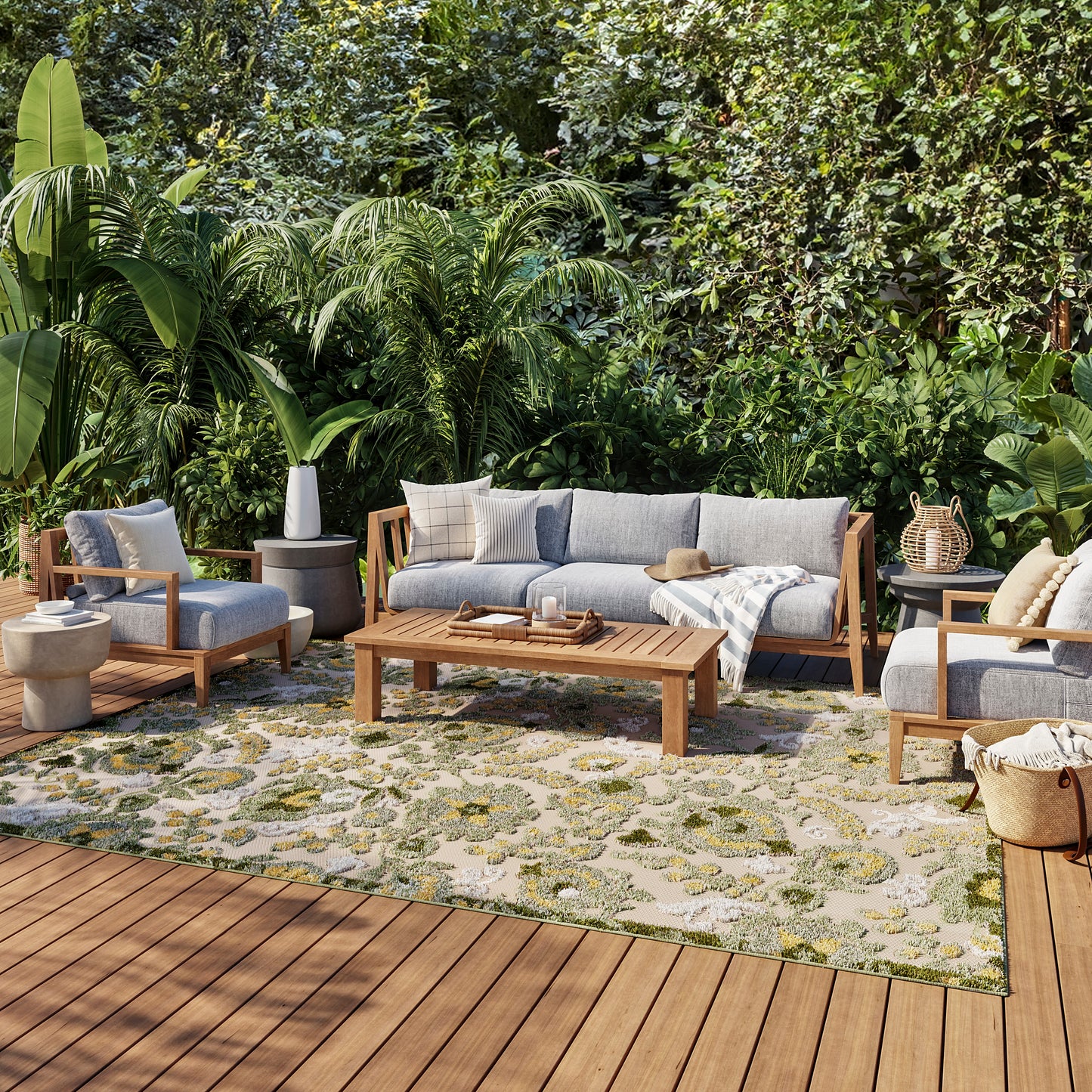 Outdoor rug (8' x 11') with a patterned design on a patio, surrounded by lush greenery.