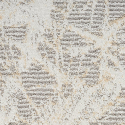 Cream, beige and gray abstract-patterned rug with textured pile; rectangular, modern living room accent.