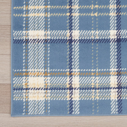 Blue plaid runner rug with white, navy and gold lines on a light wood floor; soft woven texture.