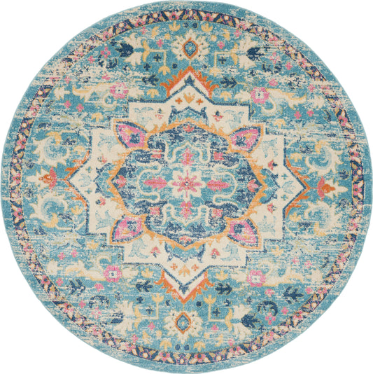 Round turquoise oriental rug with distressed blue and ivory pattern, central medallion, pink accents and floral border.