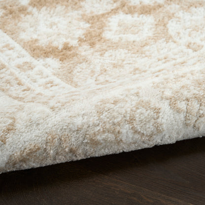 Beige and cream plush shag rug with a subtle geometric pattern, folded edge on dark wood floor.