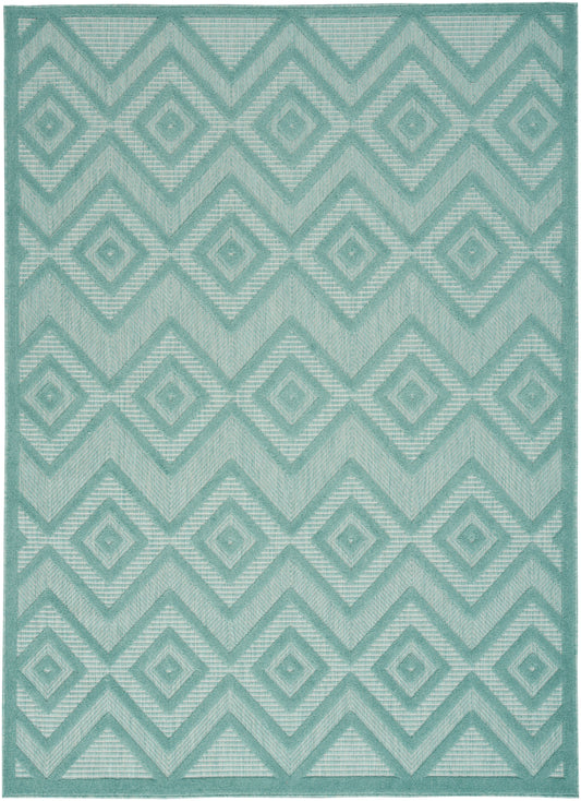 Teal geometric rug with interlocking diamond & chevron motifs; woven texture, modern tribal style.