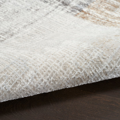 Cream-beige rug with subtle geometric pattern and plush pile on dark wood floor.