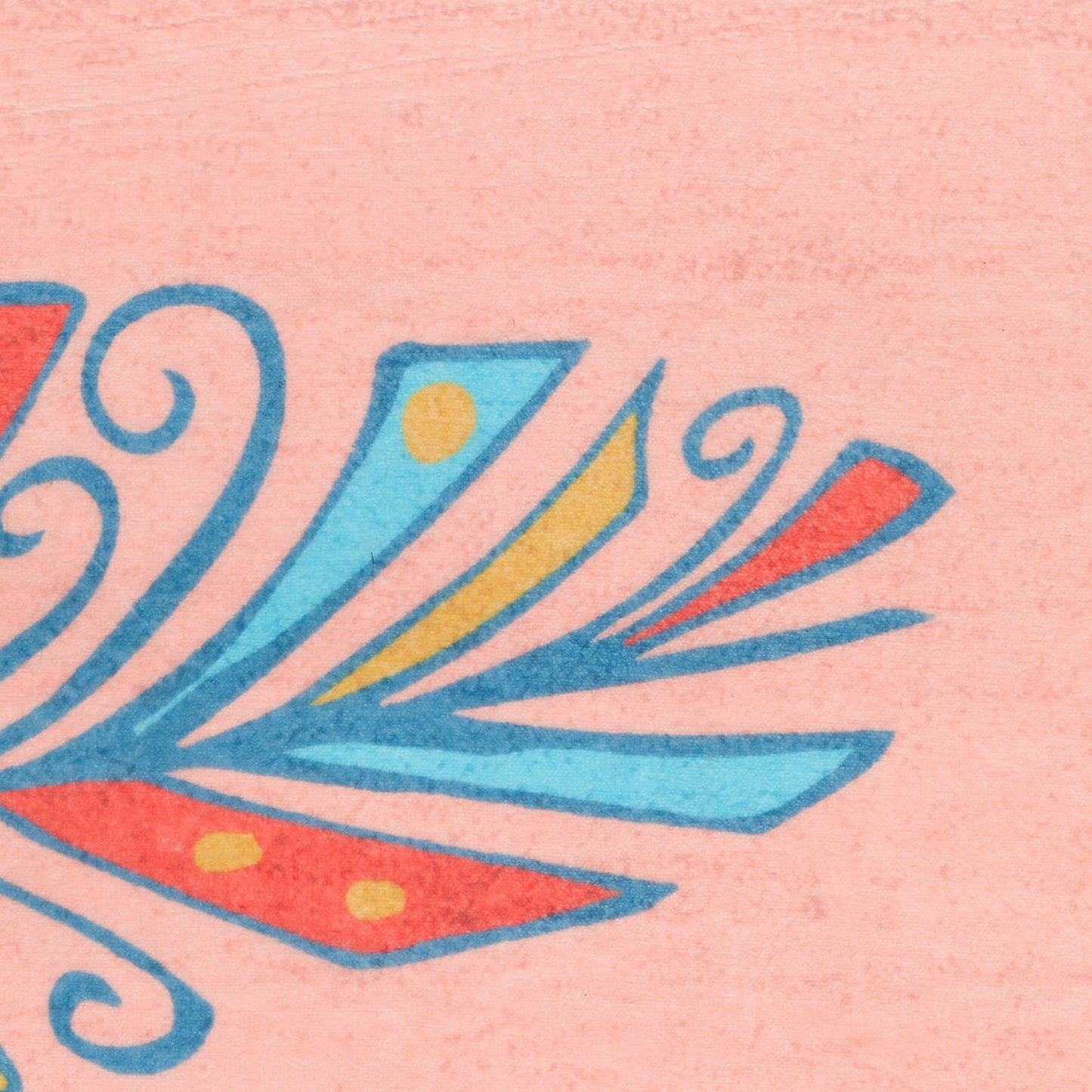 Close-up of pink fabric with blue boho feather motifs and orange-yellow accents.