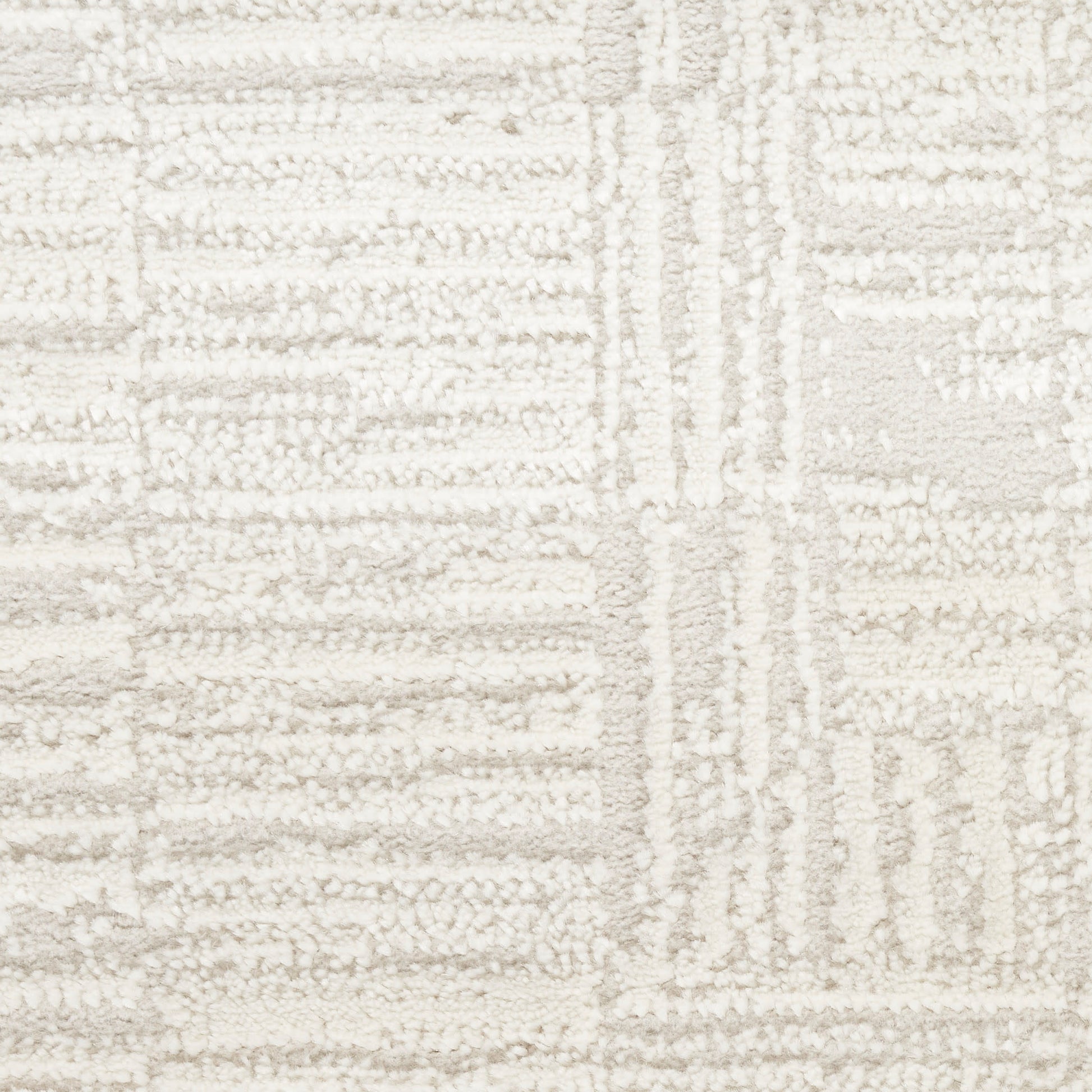 Cream textured rug with geometric beige blocks and plush loop pile.