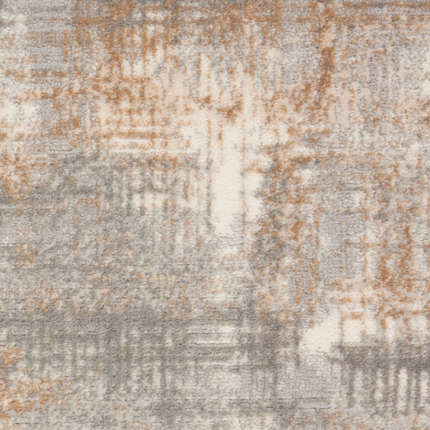 Abstract neutral area rug with beige, taupe, tan and gray tones in a soft, textured geometric pattern.