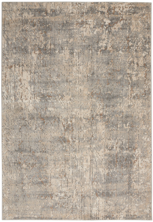 Rectangular distressed abstract area rug in gray and beige tones with a vintage, weathered pattern.