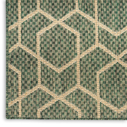Green and natural beige geometric woven rug with diamond lattice chevron pattern; textured textile.