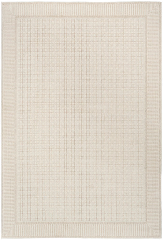Cream rectangular rug with grid-pattern center and chunky textured border for a modern neutral living room.