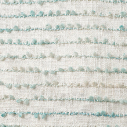 Cream woven fabric featuring horizontal rows of mint-green pom-pom fringe.