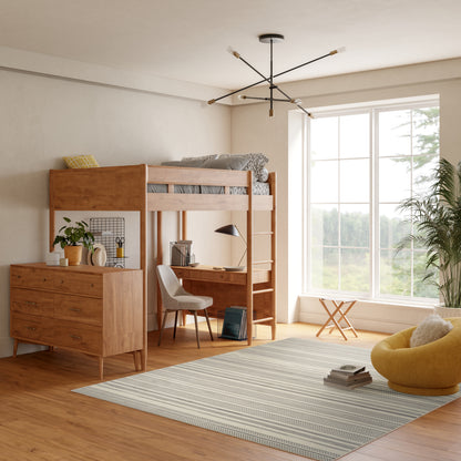 Striped rug in a room with a window, a yellow bean bag and potted plants.