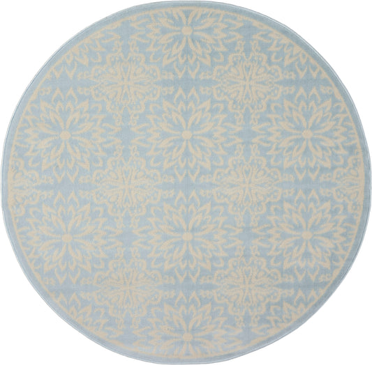 Round rug in pale blue with cream damask floral pattern; soft decorative accent for living room.