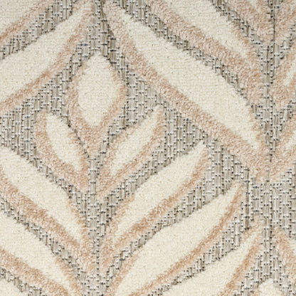 Cream, beige and taupe shag rug with tropical leaf motif; plush textured pile for a modern boho area rug.