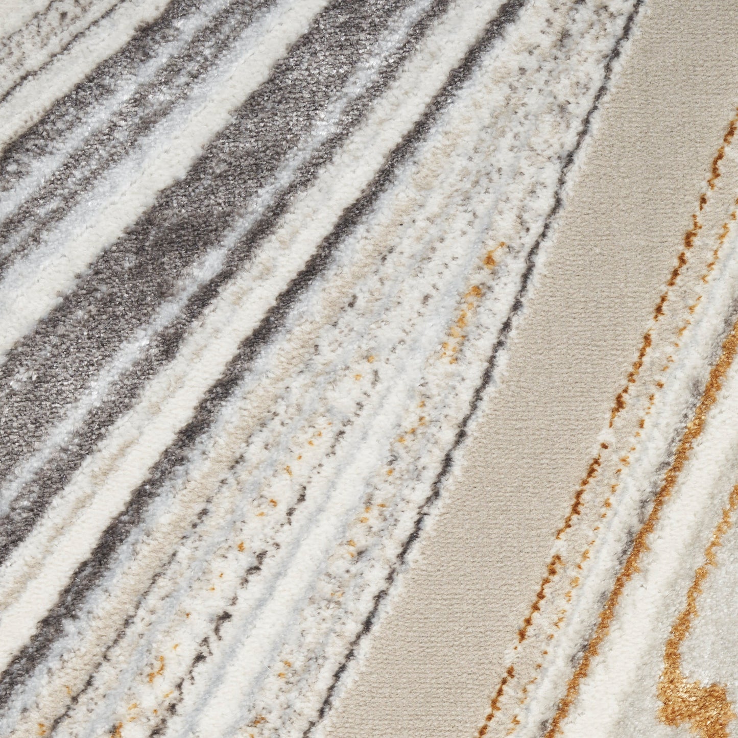 Diagonal striped rug with textured pile in gray, cream, beige and rust tones.