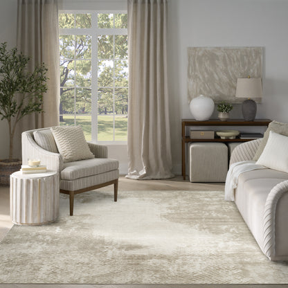 Neutral living room with beige curtains, cream sofa and armchair, textured rug, round wood side table, ottomans, console and lamp.