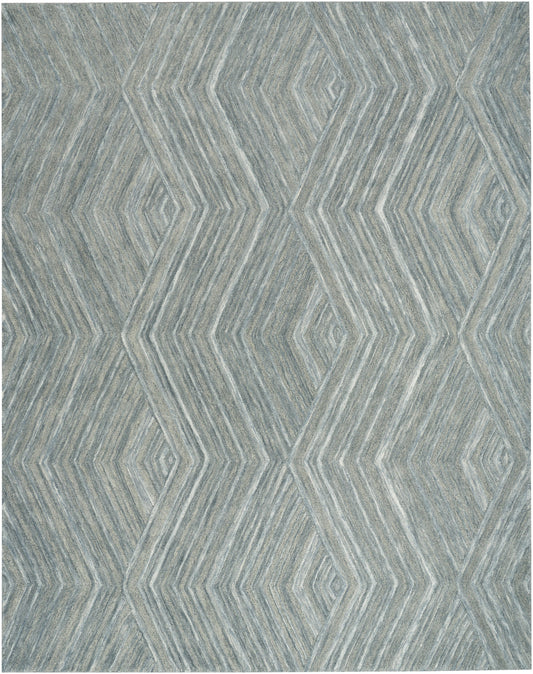 Blue-gray geometric rug with layered diamond chevron pattern and textured weave.