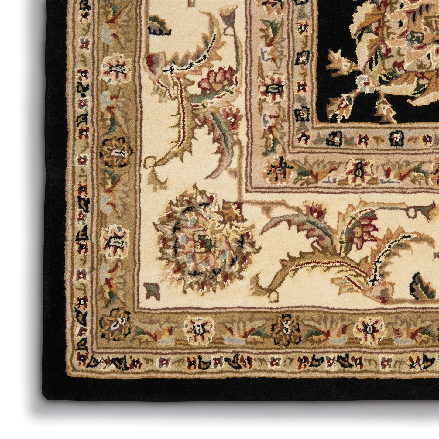 Beige oriental rug close-up with cream field, floral borders, tan edge and black outer border.