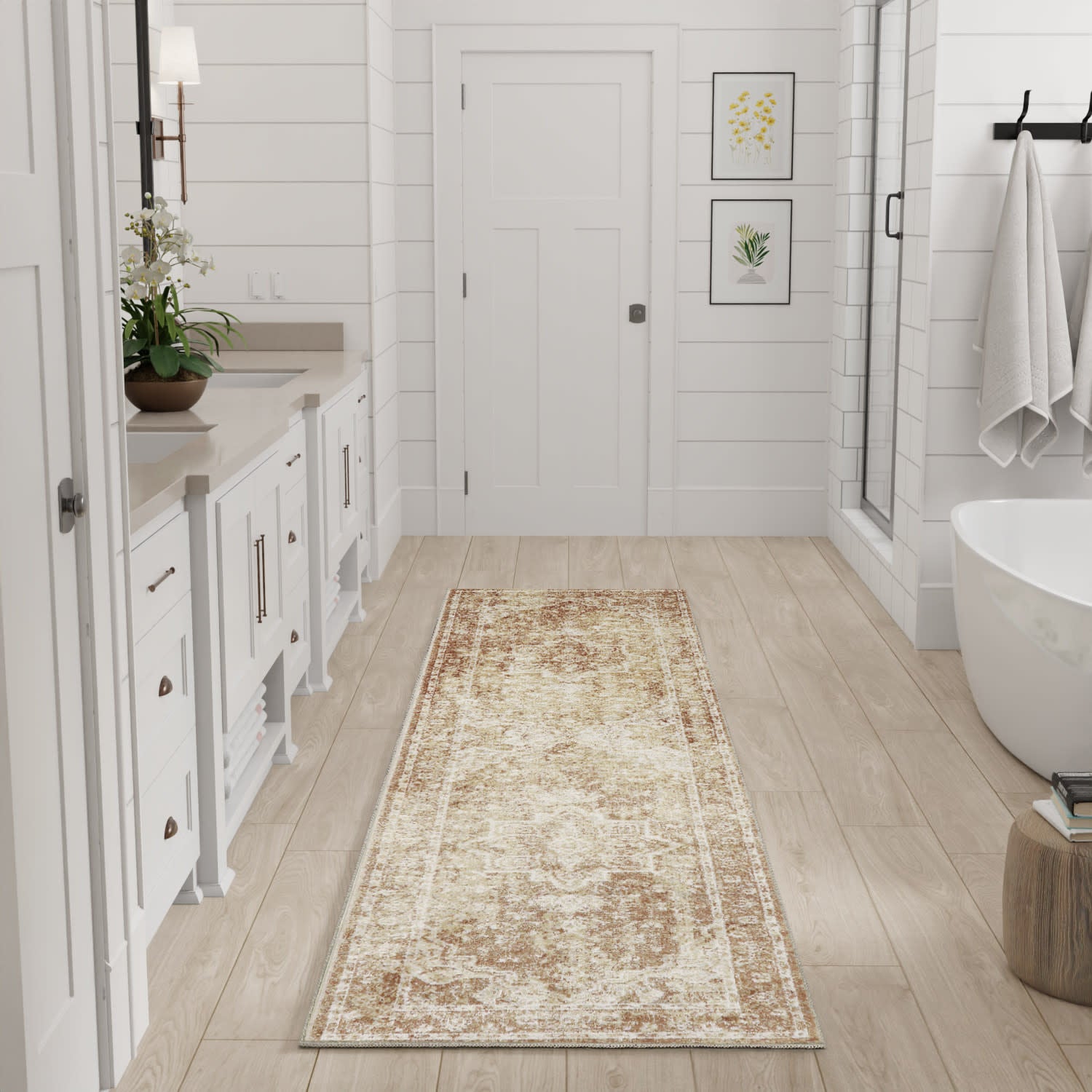 Long beige distressed vintage-style rug runner on light wood floor in a white contemporary bathroom.