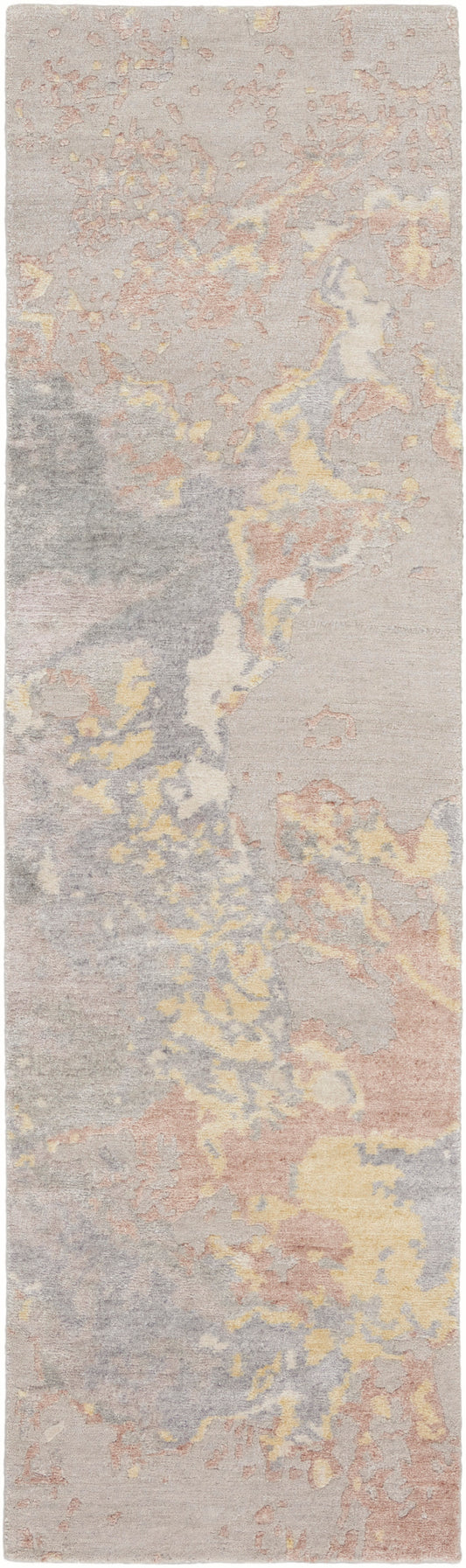 Long pastel abstract rug runner with soft pink, yellow, gray and beige tones in a marbled pattern for modern hallways.