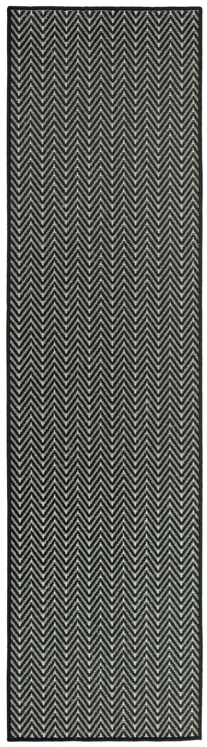 Black and white chevron rug runner with woven texture and dark border.