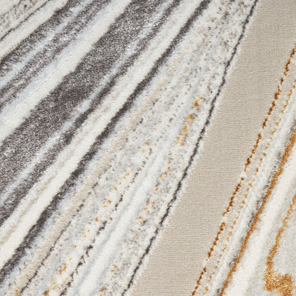 Diagonal striped neutral area rug in gray, ivory, beige with gold accents; soft, textured pile.
