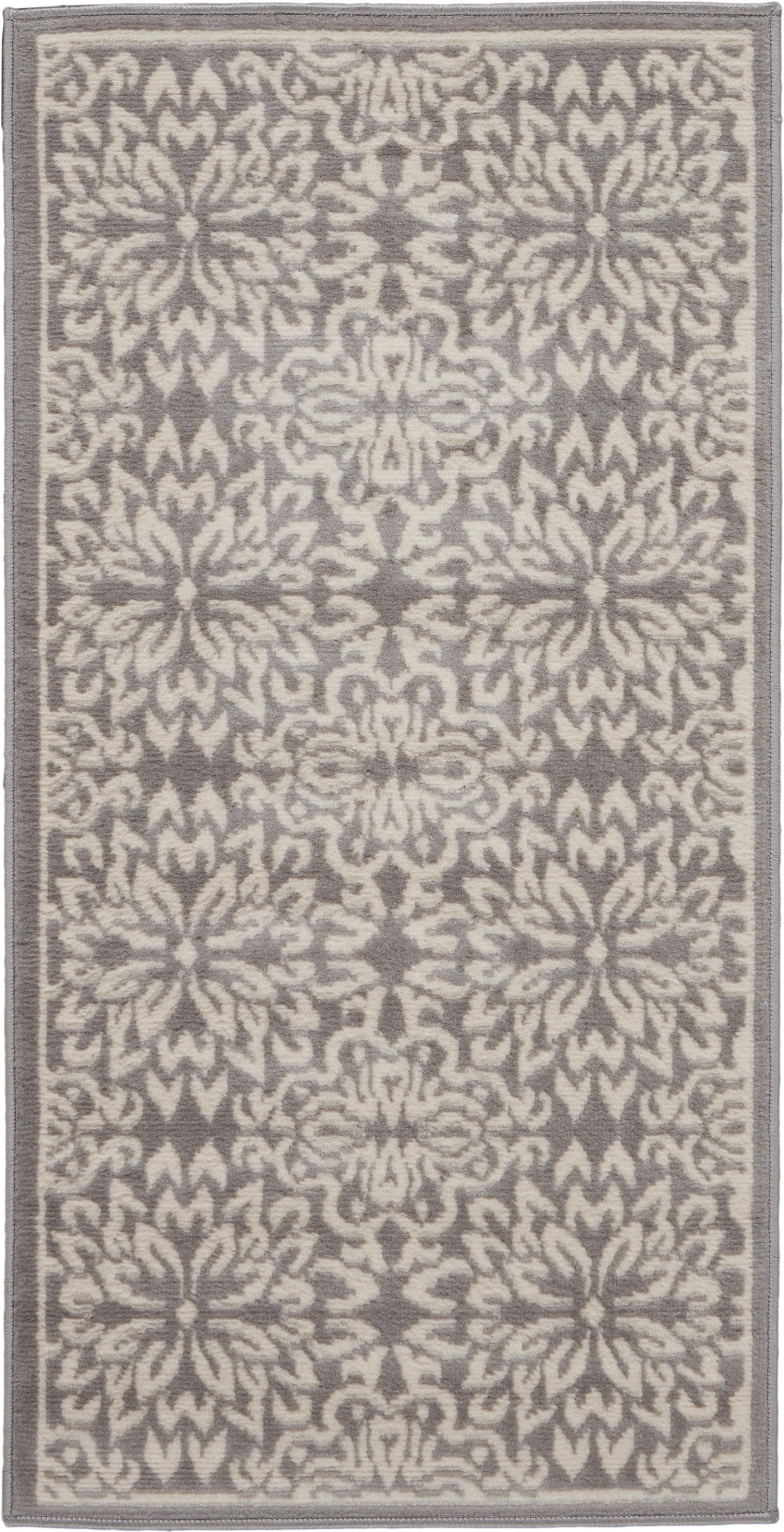 Gray & beige patterned rug with floral medallions and a narrow border.
