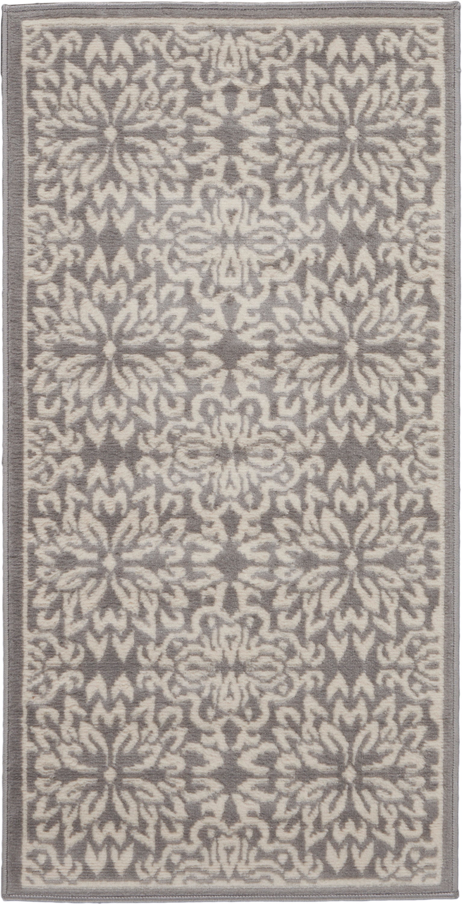 Gray & beige patterned rug with floral medallions and a narrow border.