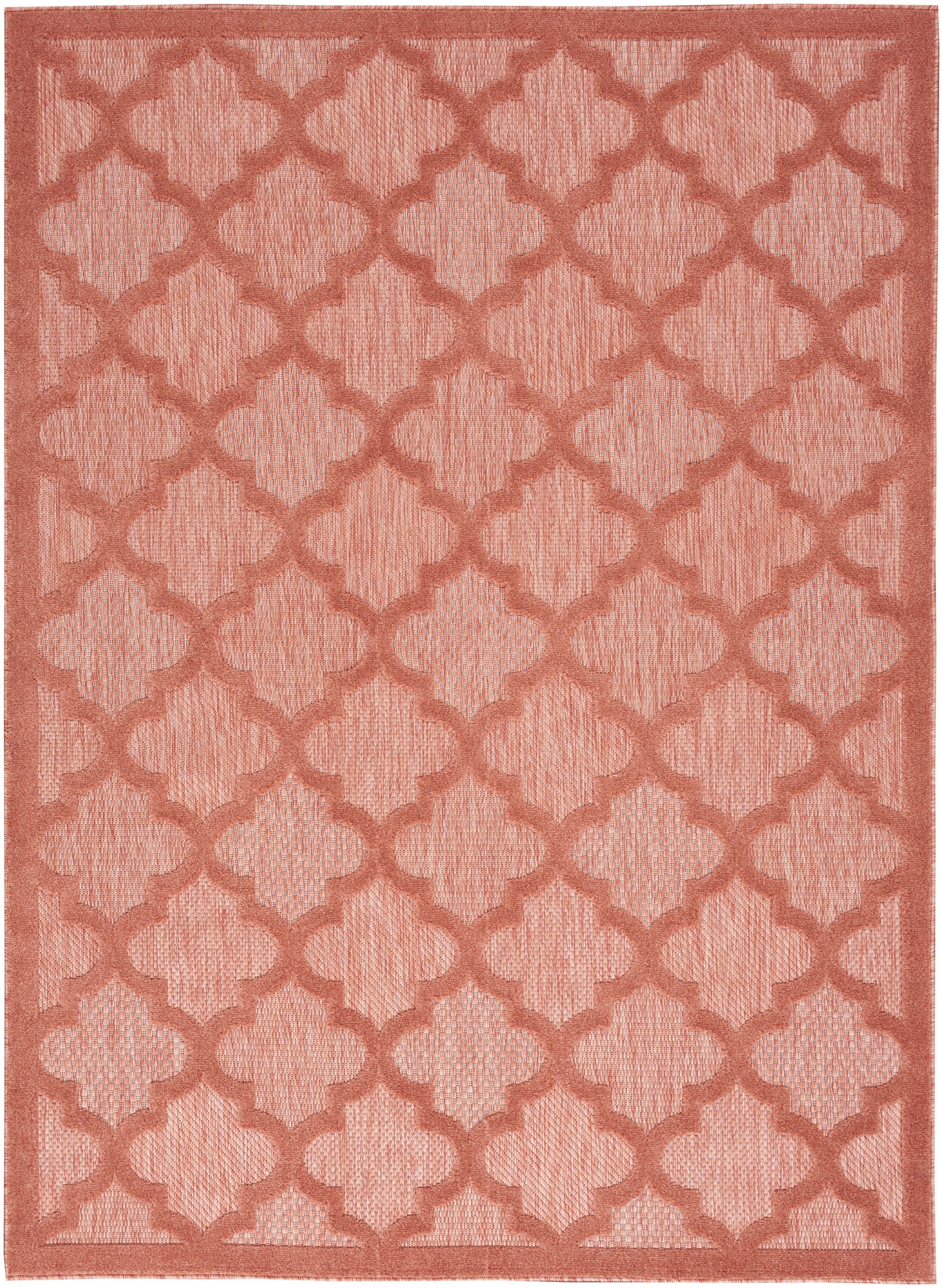 Coral rug with repeating trellis quatrefoil pattern and woven texture; rectangular with border.