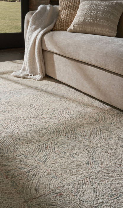 Beige rug with a light, subtle pattern in a cozy living room.