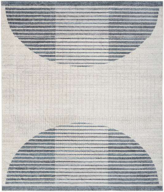 Beige rug with mirrored navy blue striped semicircles on top and bottom, geometric modern design.