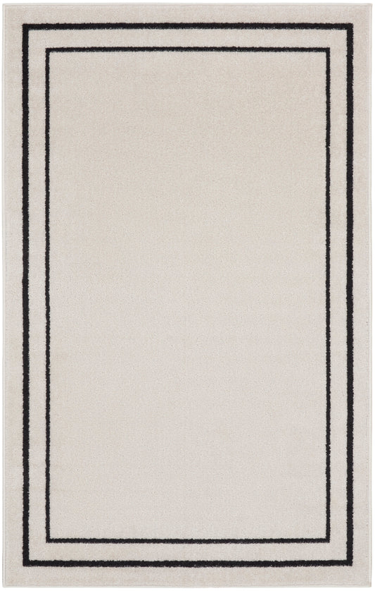 Beige rectangular rug with a black double border framing an inner rectangle; modern minimalist style.