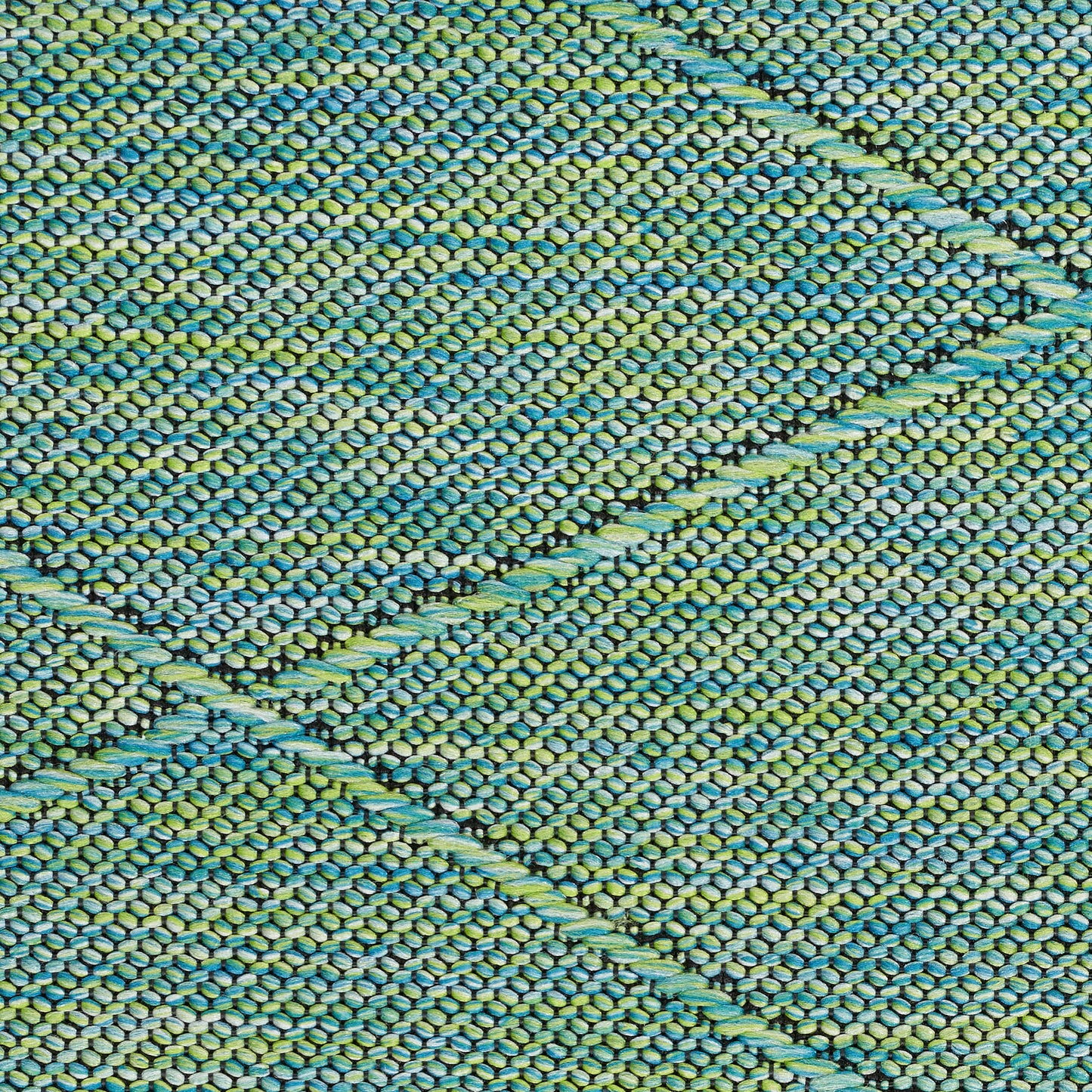 Close-up of a woven textile rug in teal, blue and lime green, with diagonal diamond stripe patterns.