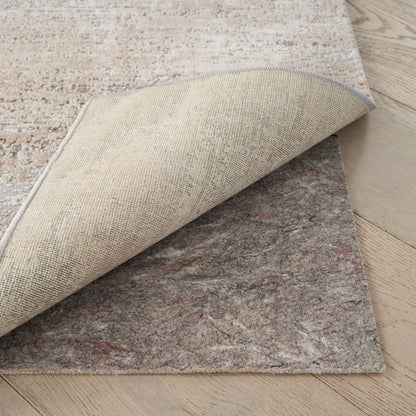 Beige textured runner rug with light blue binding, curled to reveal a gray marbled underside; layered on wood floor.