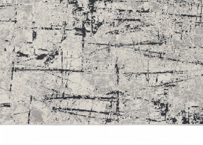 Gray distressed abstract texture with black streaks; rugged, contemporary pattern for decor.
