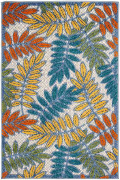 Tropical leaf-patterned area rug with yellow, orange, teal and green fronds on cream, blue border.
