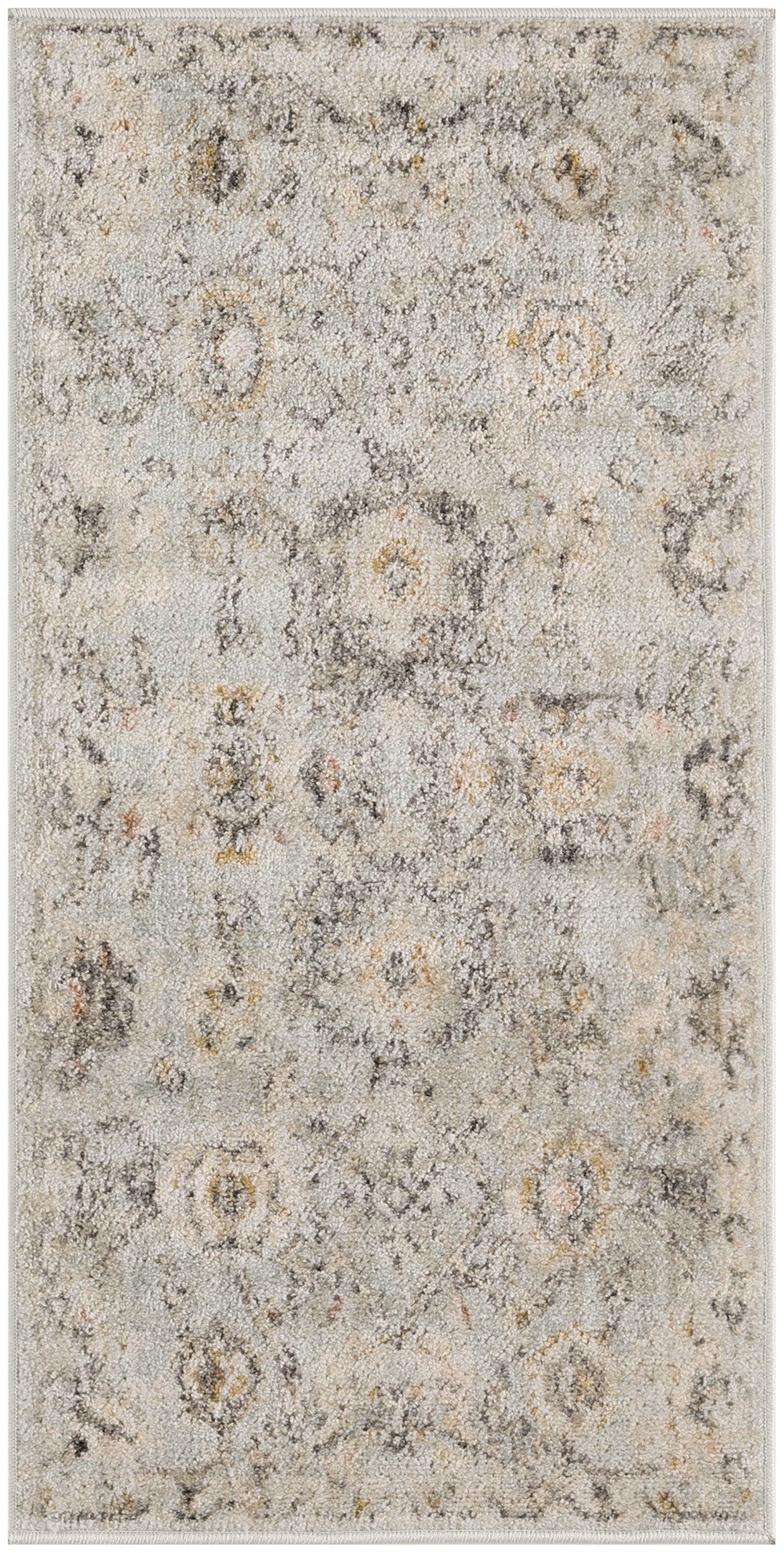 Muted ivory-gray rug with a distressed floral medallion pattern and subtle gold accents.