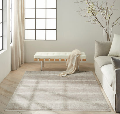 Soft beige area rug (4' x 6') with a subtle gray wash, low-pile, contemporary living room styling.