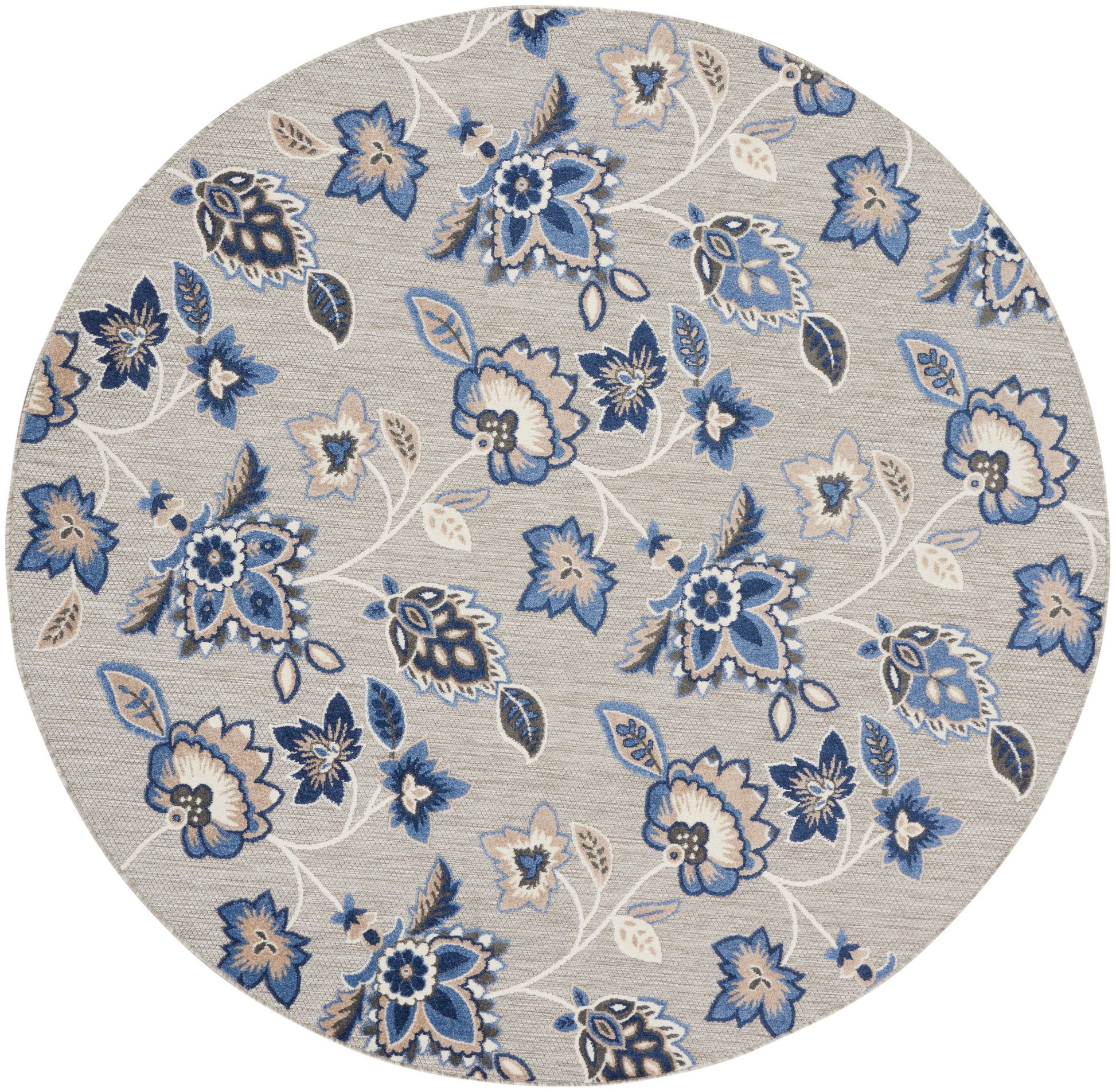 Round beige rug featuring blue floral pattern with white vines and leaves.
