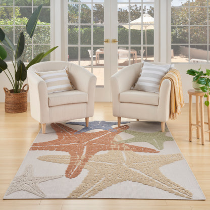 Outdoor rug with starfish pattern in beige, tan, coral and sage; 5' x 8'.