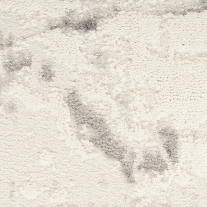 Cream shag rug with plush texture and subtle gray marbling, ideal for cozy living areas.