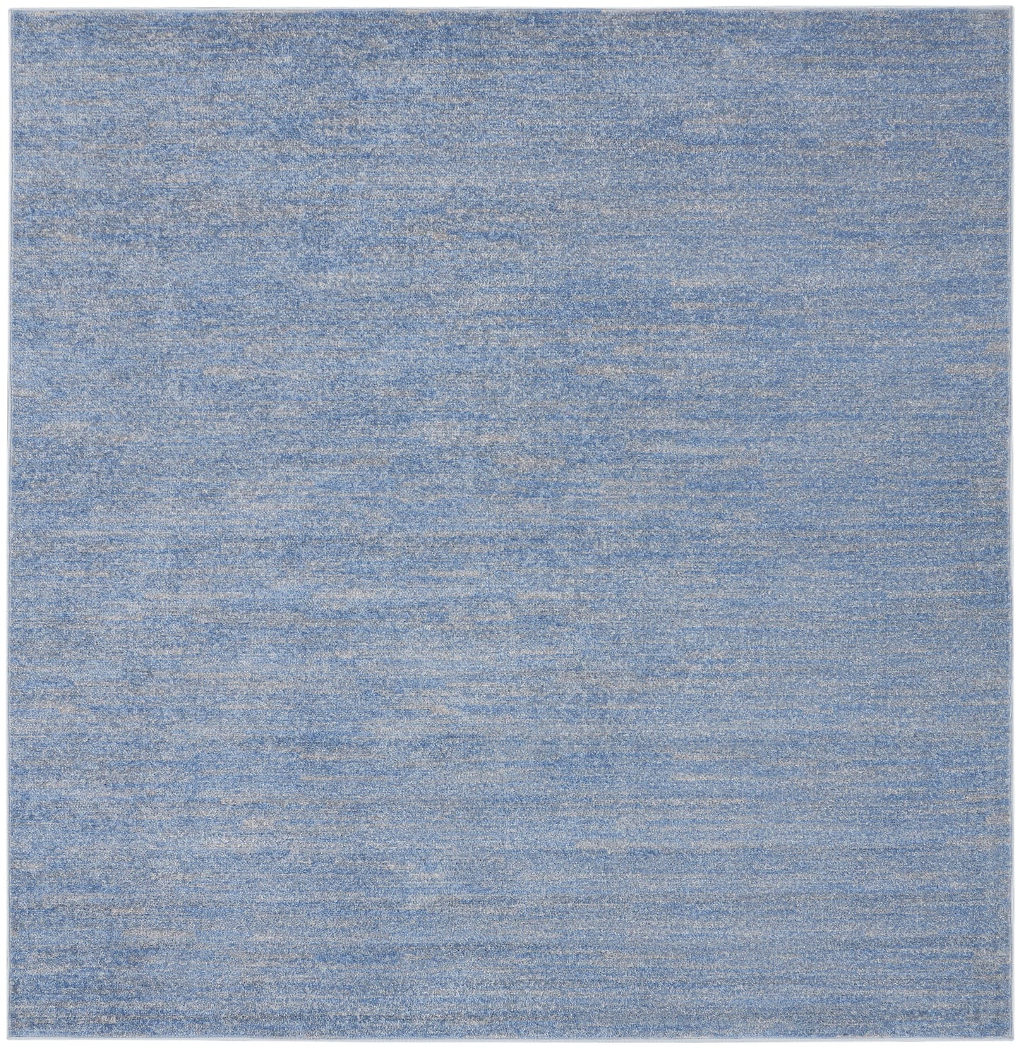 Blue heathered flat-weave rug, rectangular with soft mottled texture; modern casual living room or bedroom rug.
