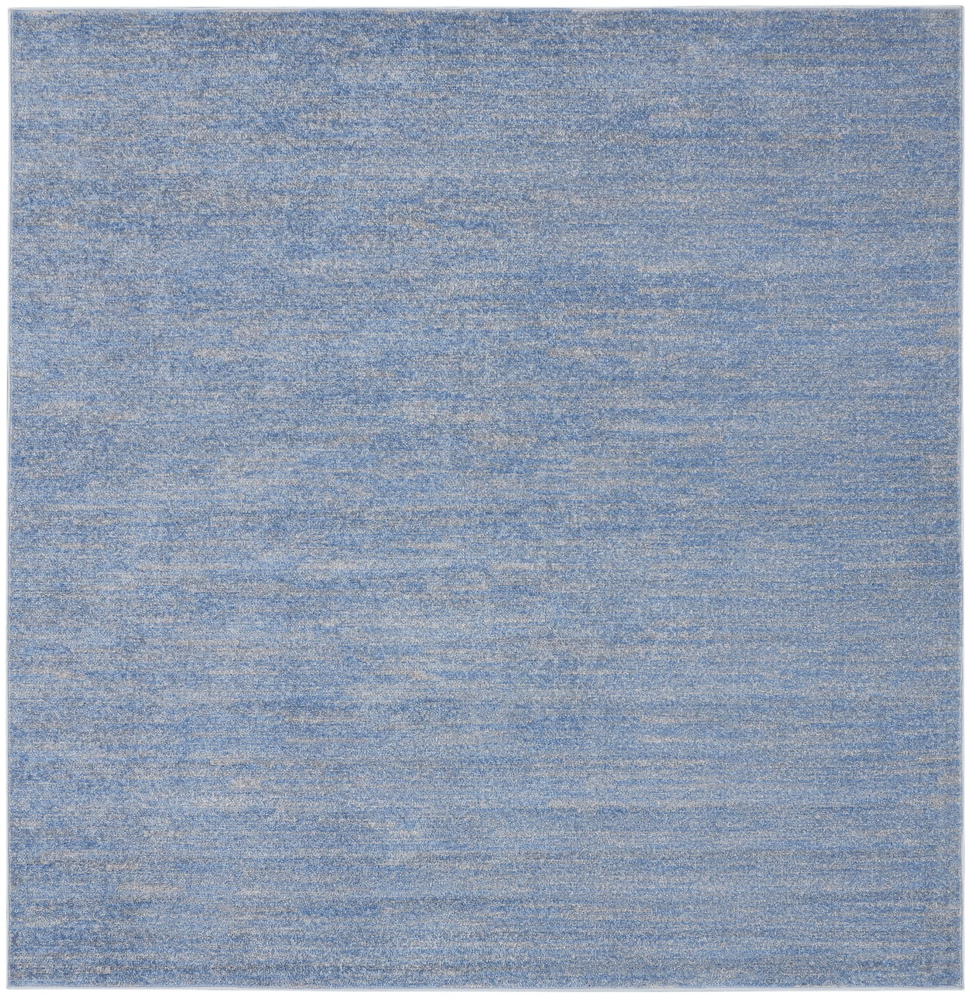 Blue heathered flat-weave rug, rectangular with soft mottled texture; modern casual living room or bedroom rug.