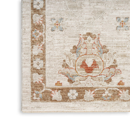 Soft cream oriental rug with brown border and pastel floral motifs; close-up corner.