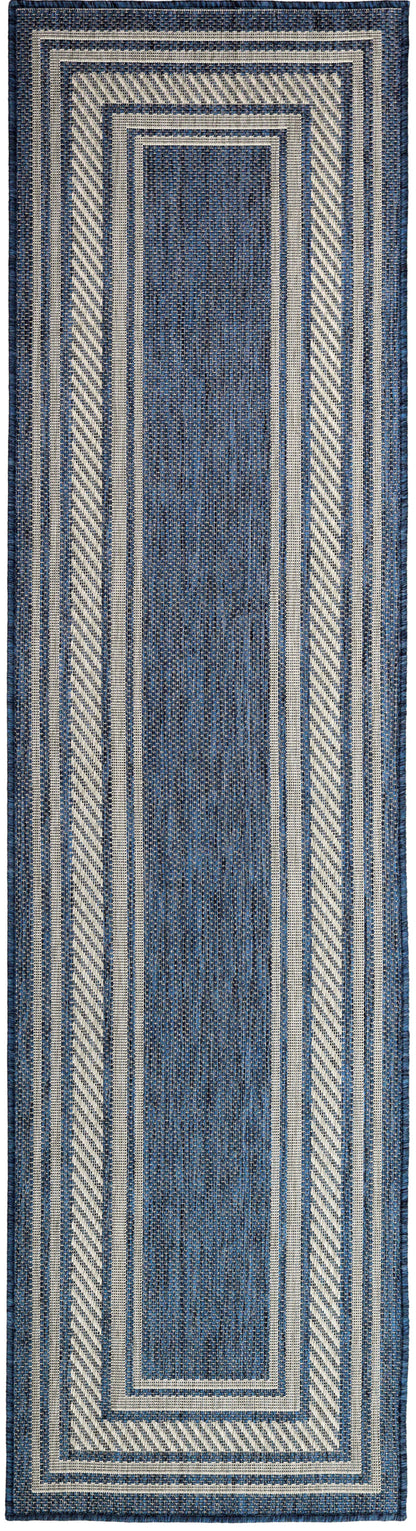 Indigo blue woven runner rug with ivory layered borders and diagonal striped accents.