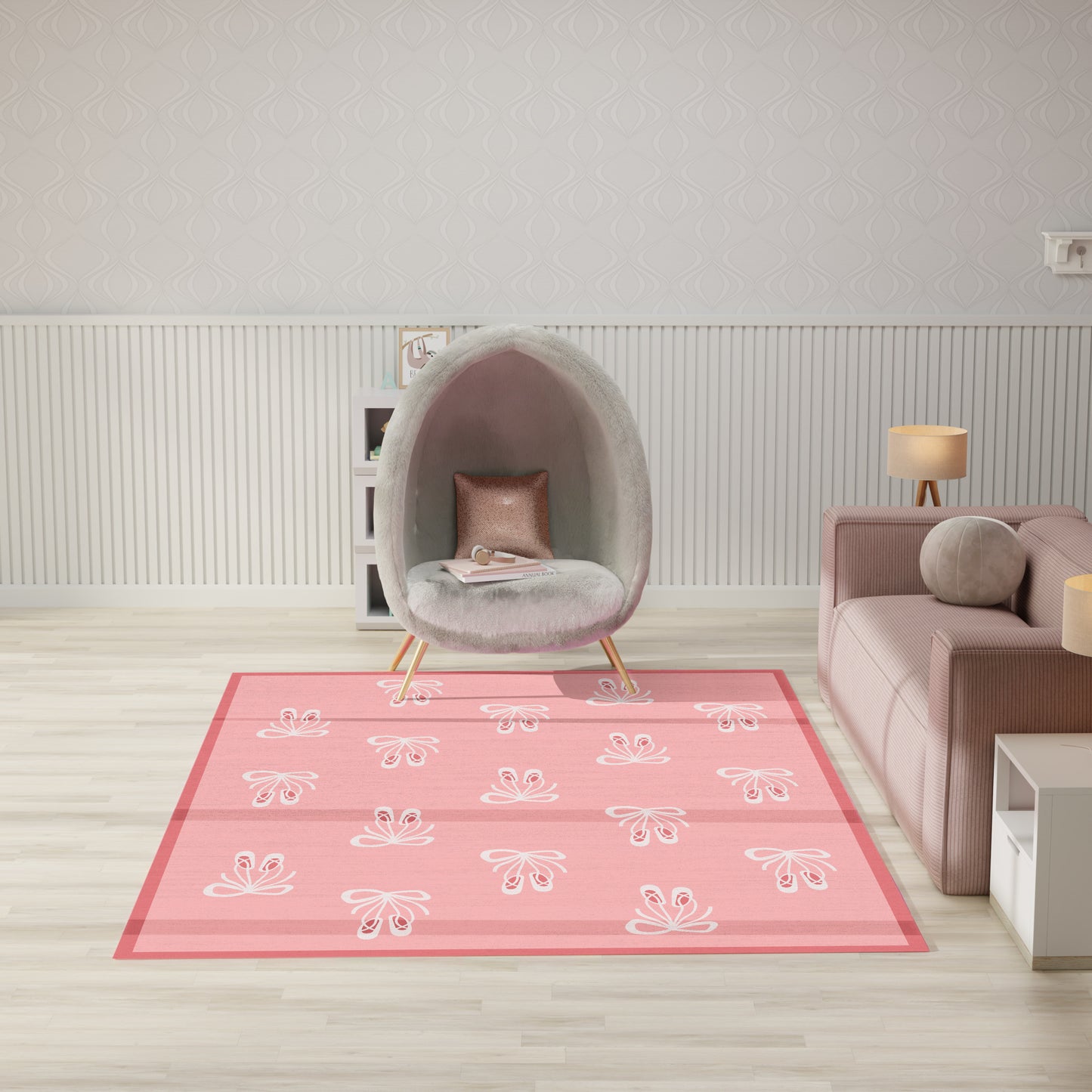 Pink-bordered area rug with white floral motifs in a modern living room, gray faux-fur egg chair and pink sofa.