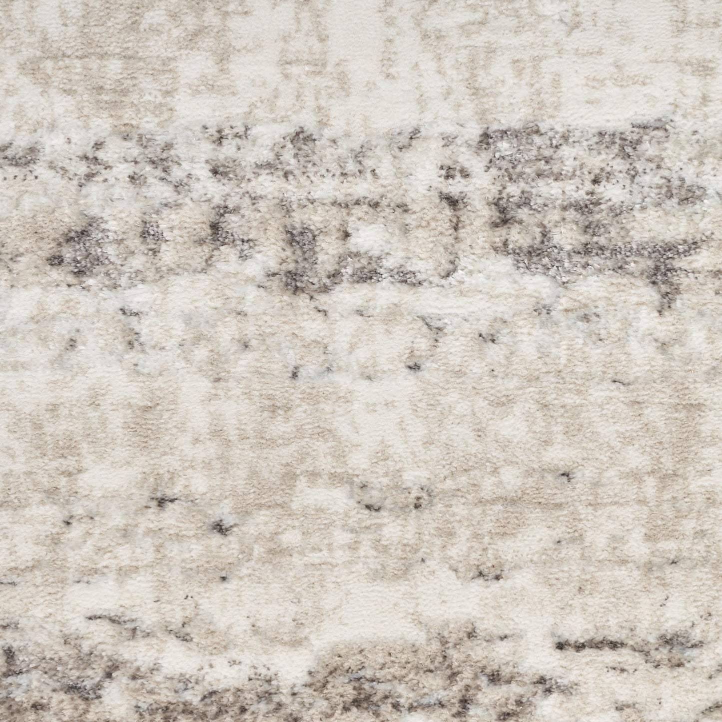 Cream-beige distressed-pattern area rug with gray wash accents; soft, plush texture for modern living spaces.