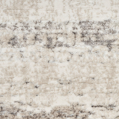 Cream-beige distressed-pattern area rug with gray wash accents; soft, plush texture for modern living spaces.
