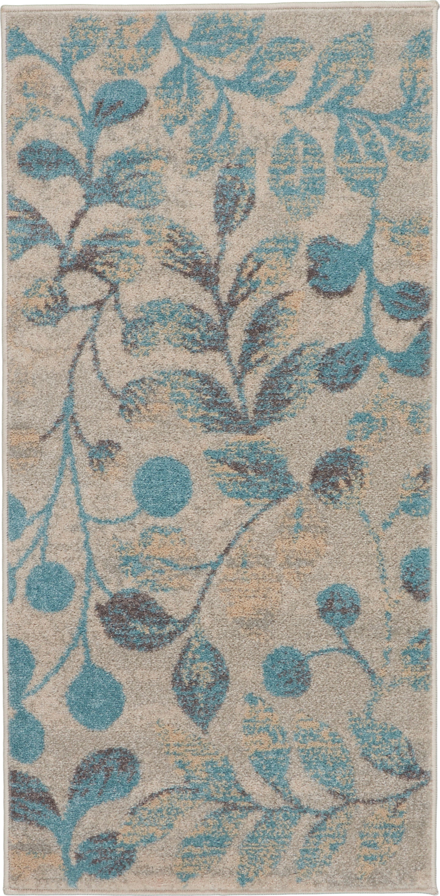 Beige rectangular rug with teal-blue leafy vine pattern and textured pile.