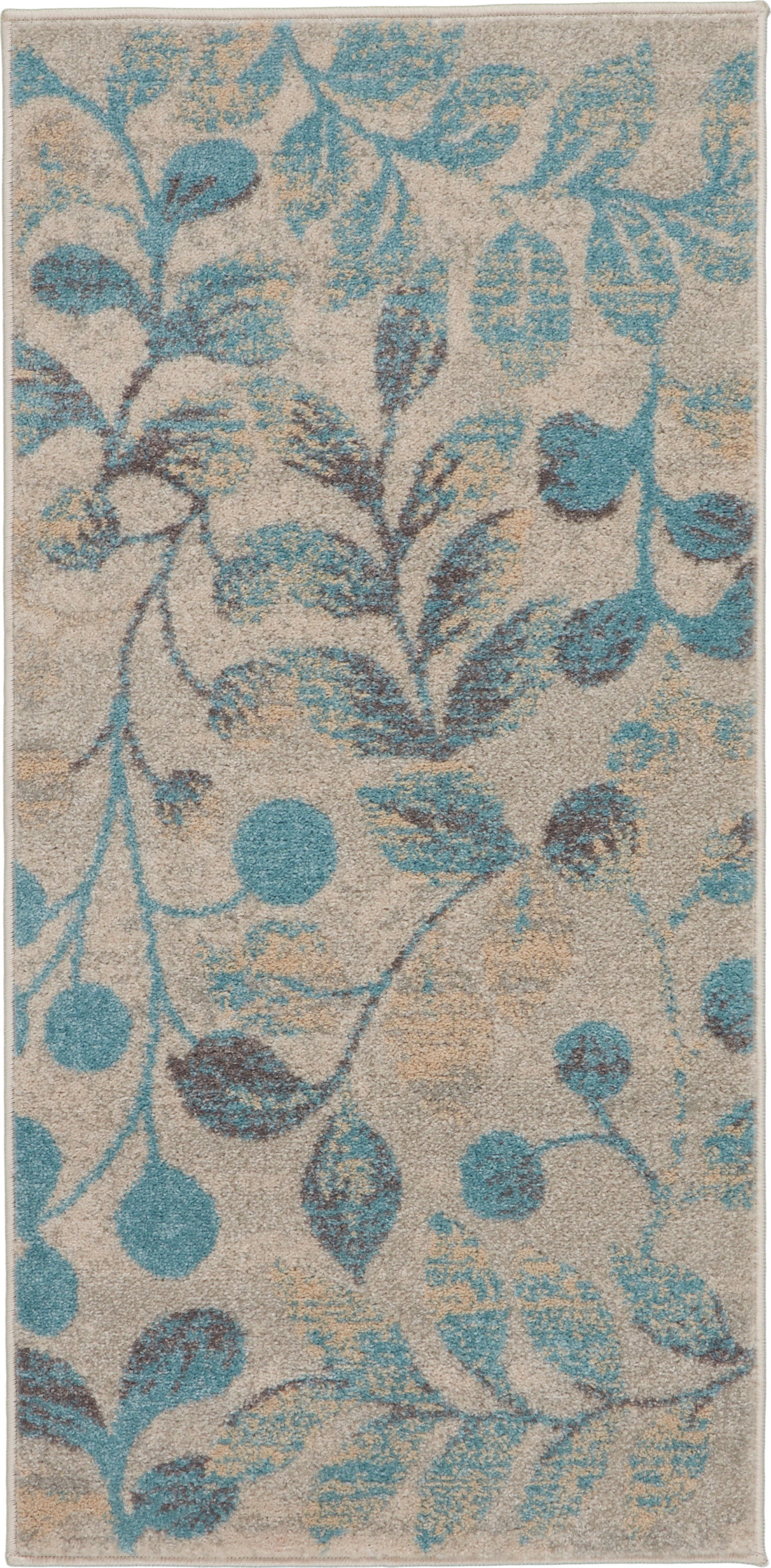 Beige rectangular rug with teal-blue leafy vine pattern and textured pile.